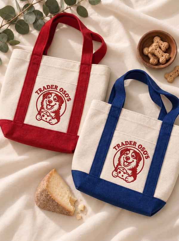 Two tote bags with a custom dog version of the Trader Joe's logo on a light fabric background.