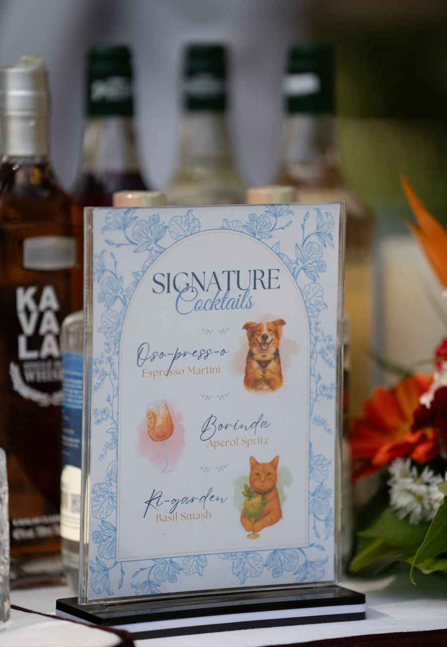 A wedding bar table with bottles and glassware arranged for the reception